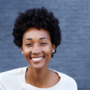 Portrait of beautiful young african woman looking happy